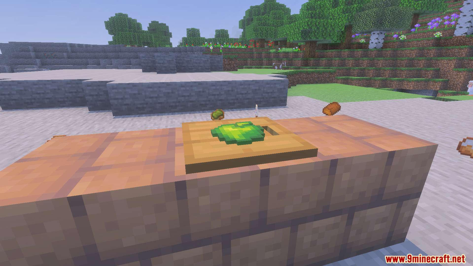 A green apple item placed on a wooden pressure plate on stone bricks