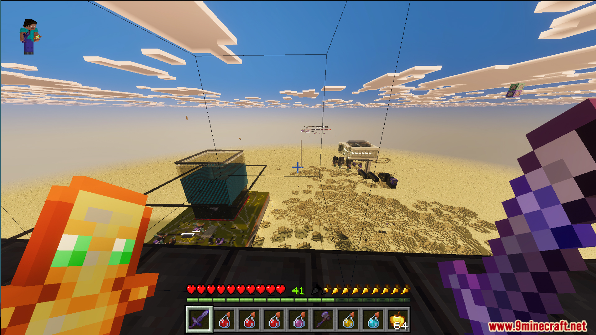 Elevated view of a desert battle arena with structures and a glass enclosure
