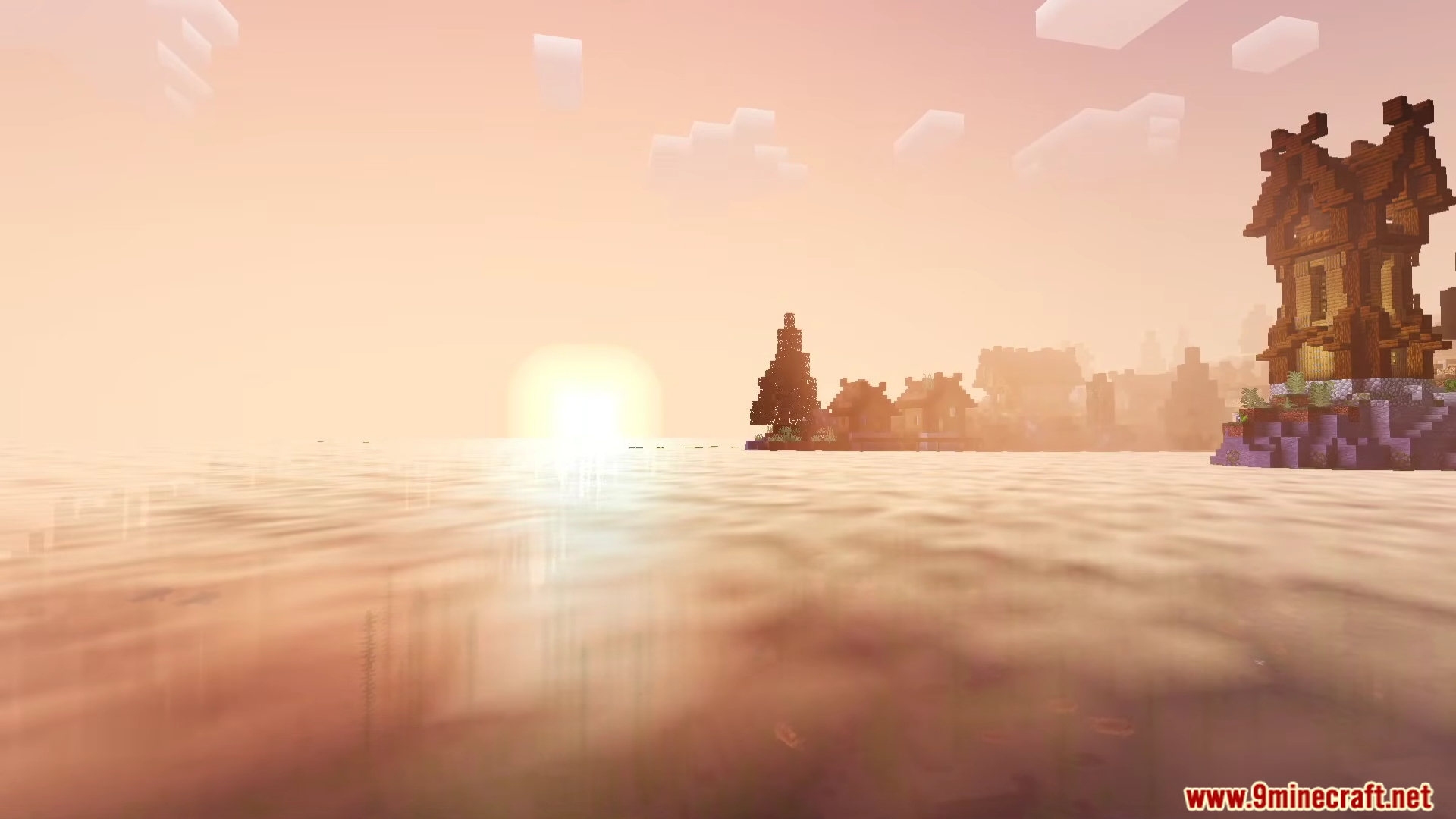 Newb Lumina Shader Screenshot 10 A tall wooden structure stands on a cliff overlooking a glowing sunset ocean