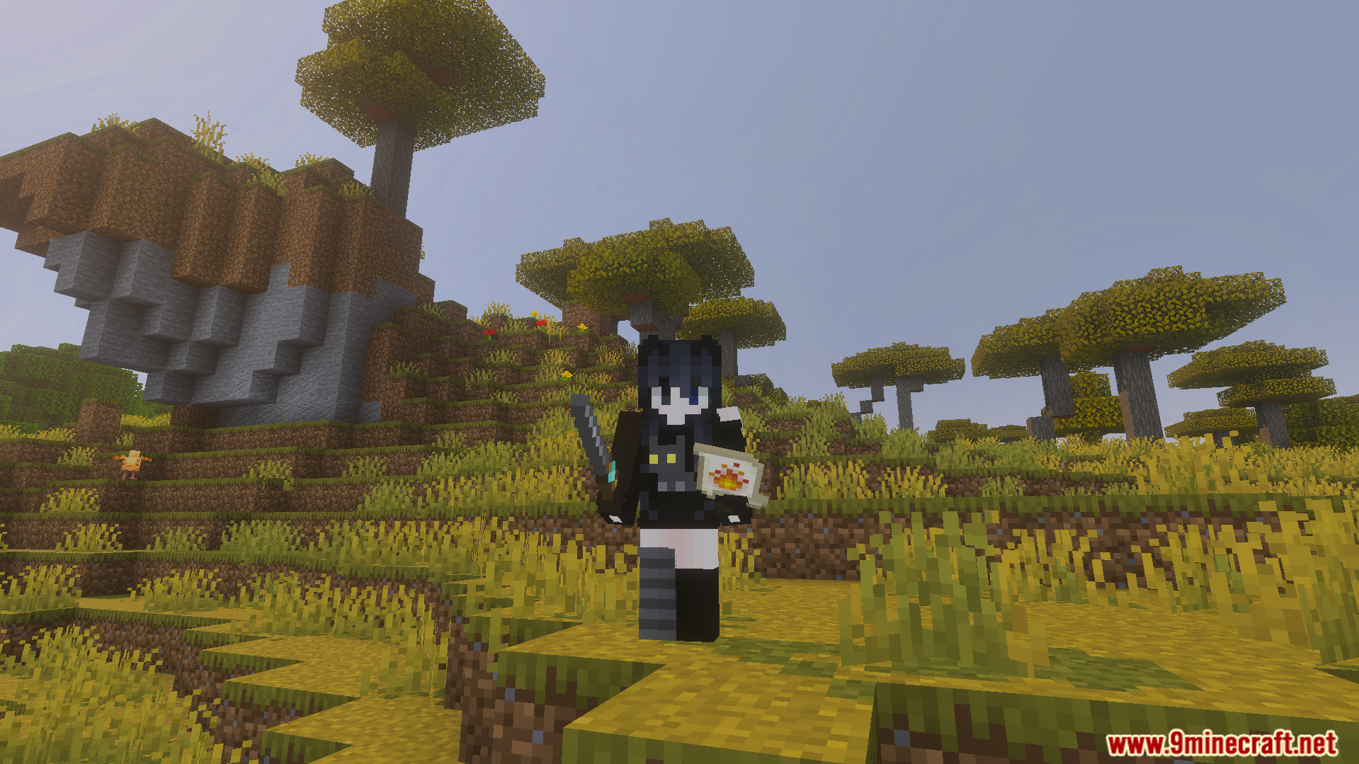 Minecraft player standing in a savanna biome holding a wand and fire scroll
