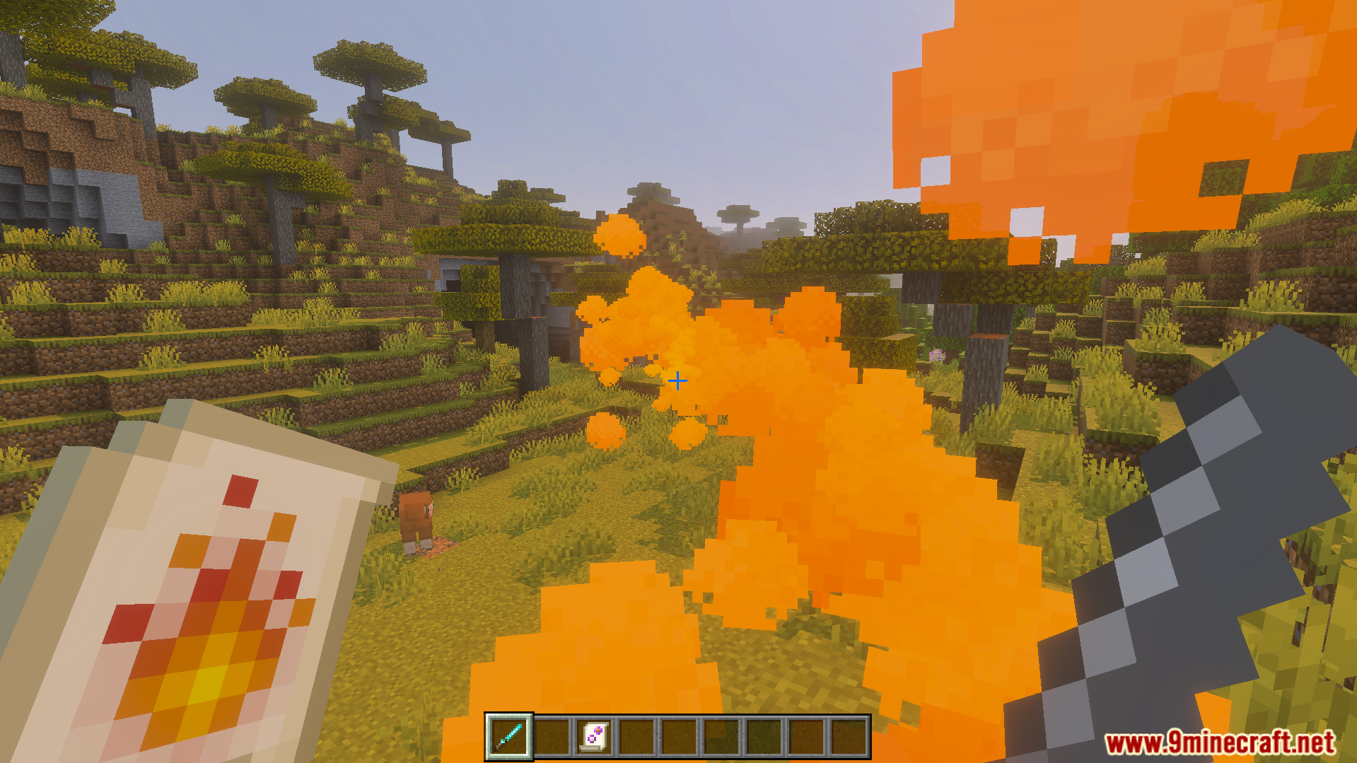 Casting a fire spell with orange particles in a savanna biome landscape