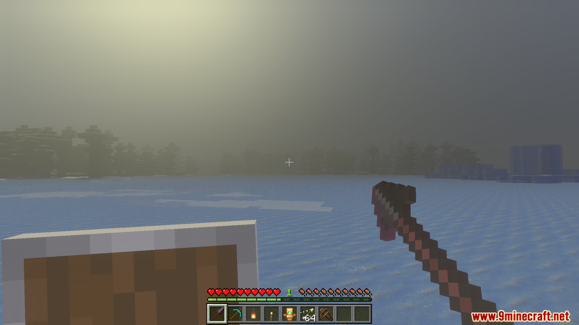 Offhand Addon Screenshot 4 Player holding a shield in the offhand while exploring a snowy biome