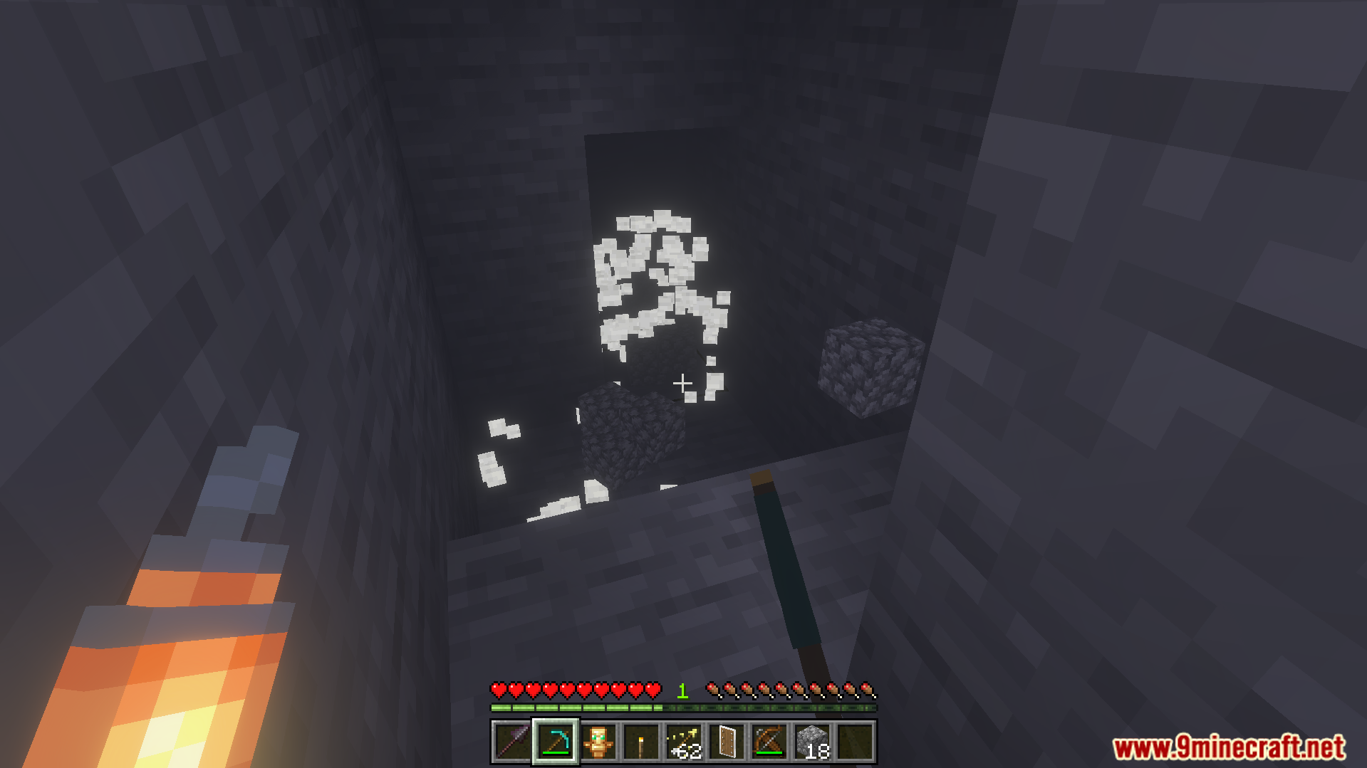 Offhand Addon Screenshot 6 Player holding a torch in the left hand while mining a cave