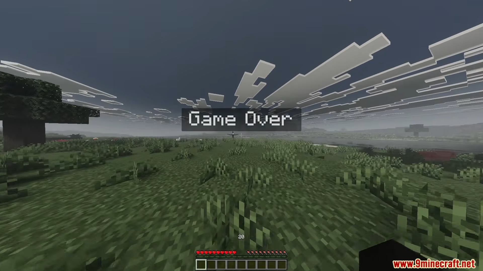 A game over screen showing a tall dark entity in a grassy field