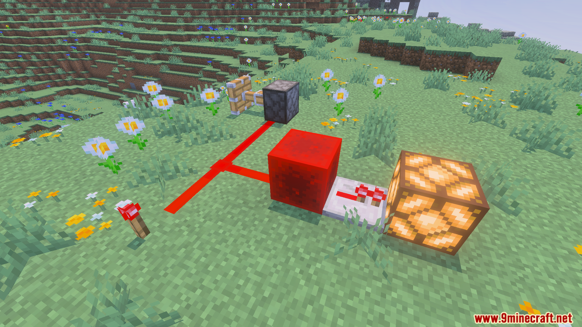 Redstone components including a piston and lamp activated by glowing redstone dust