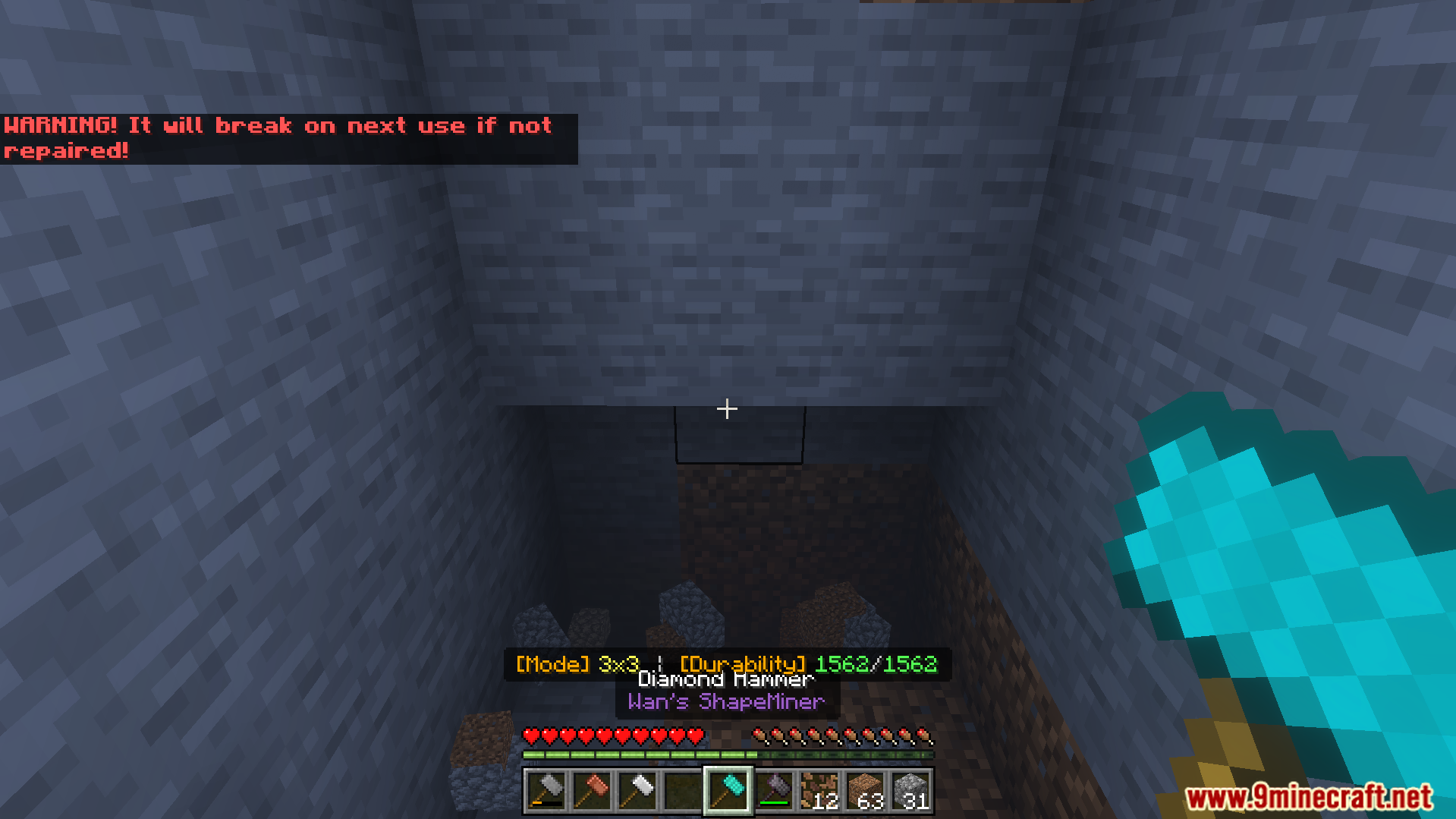 ShapeMiner Addon Screenshot 7 Player holding a diamond hammer in a stone tunnel