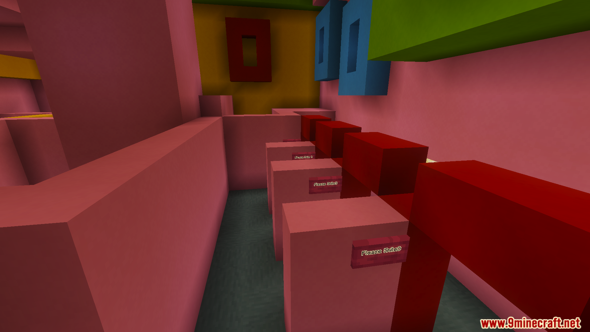 Pink blocks with signs in a colorful maze room