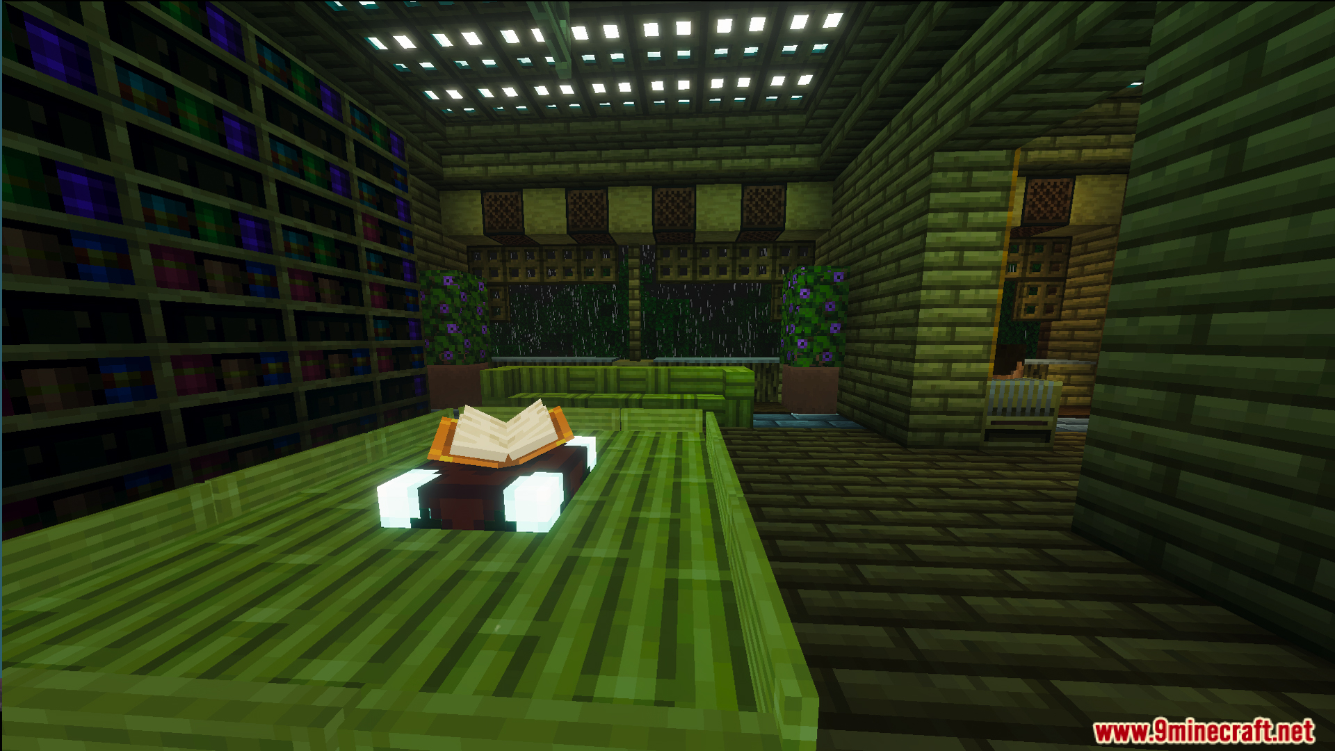 Cozy library room with bookshelves and an open book on a green table