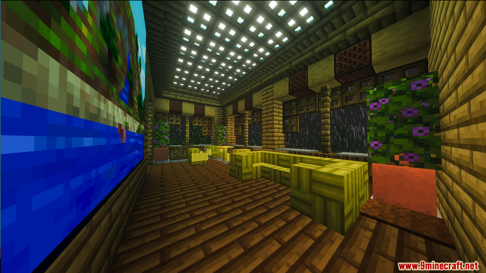 Interior of Survival Filo House with yellow furniture and a large wall painting