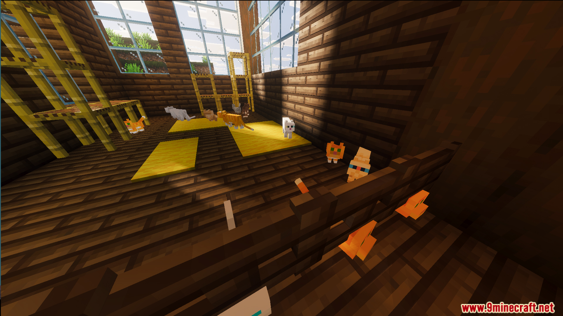 Survival Log Cabin House 86 Map Screenshot 6 Multiple cats playing on yellow carpets inside a wooden room with tall bamboo scaffolding