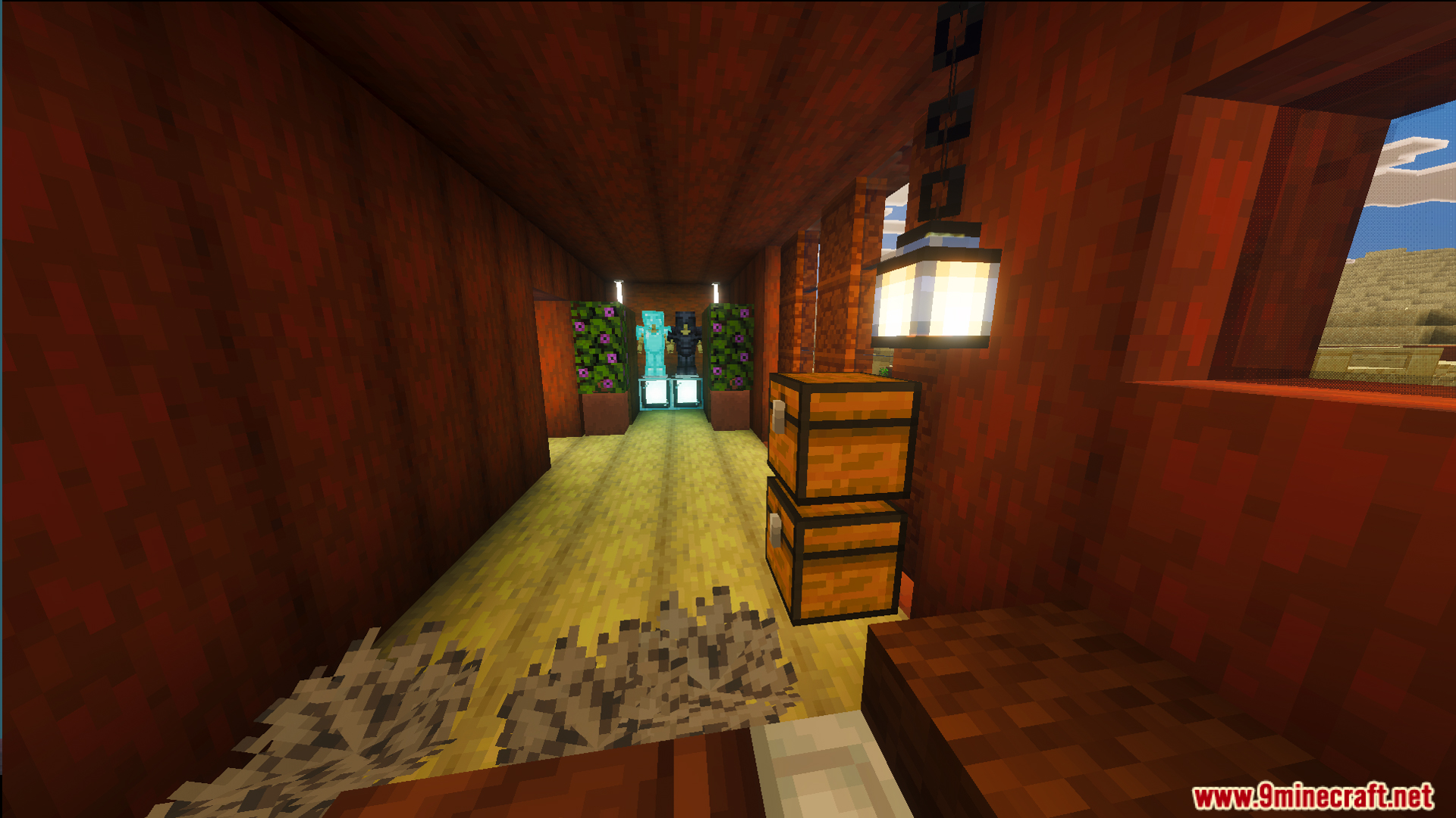 Interior view of a wooden hallway with armor stands and stacked storage chests