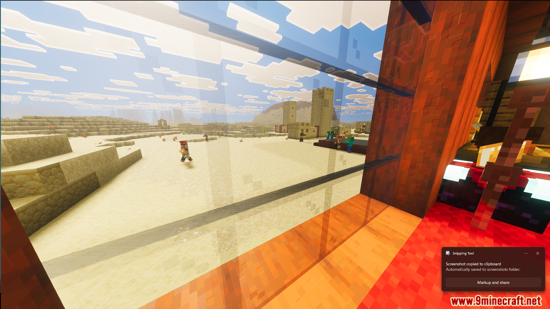 Looking through a glass window at a village in the desert biome