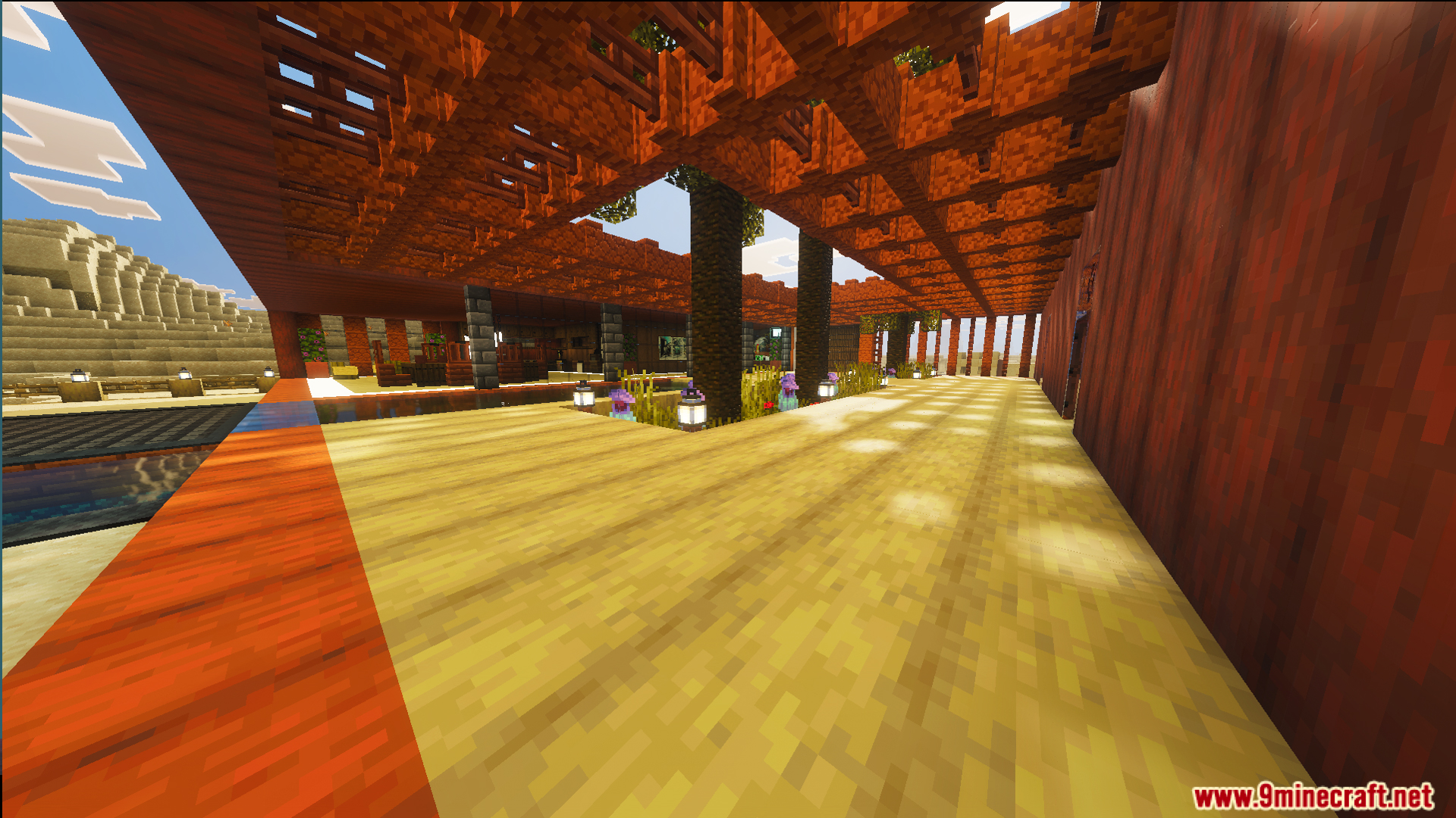 Spacious wooden interior of a modern desert house with lanterns and trees