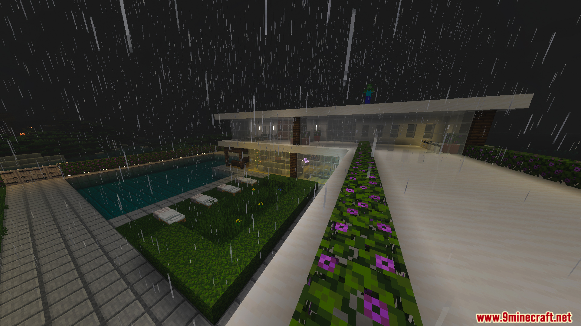 Modern white house exterior with a swimming pool and garden during the rain