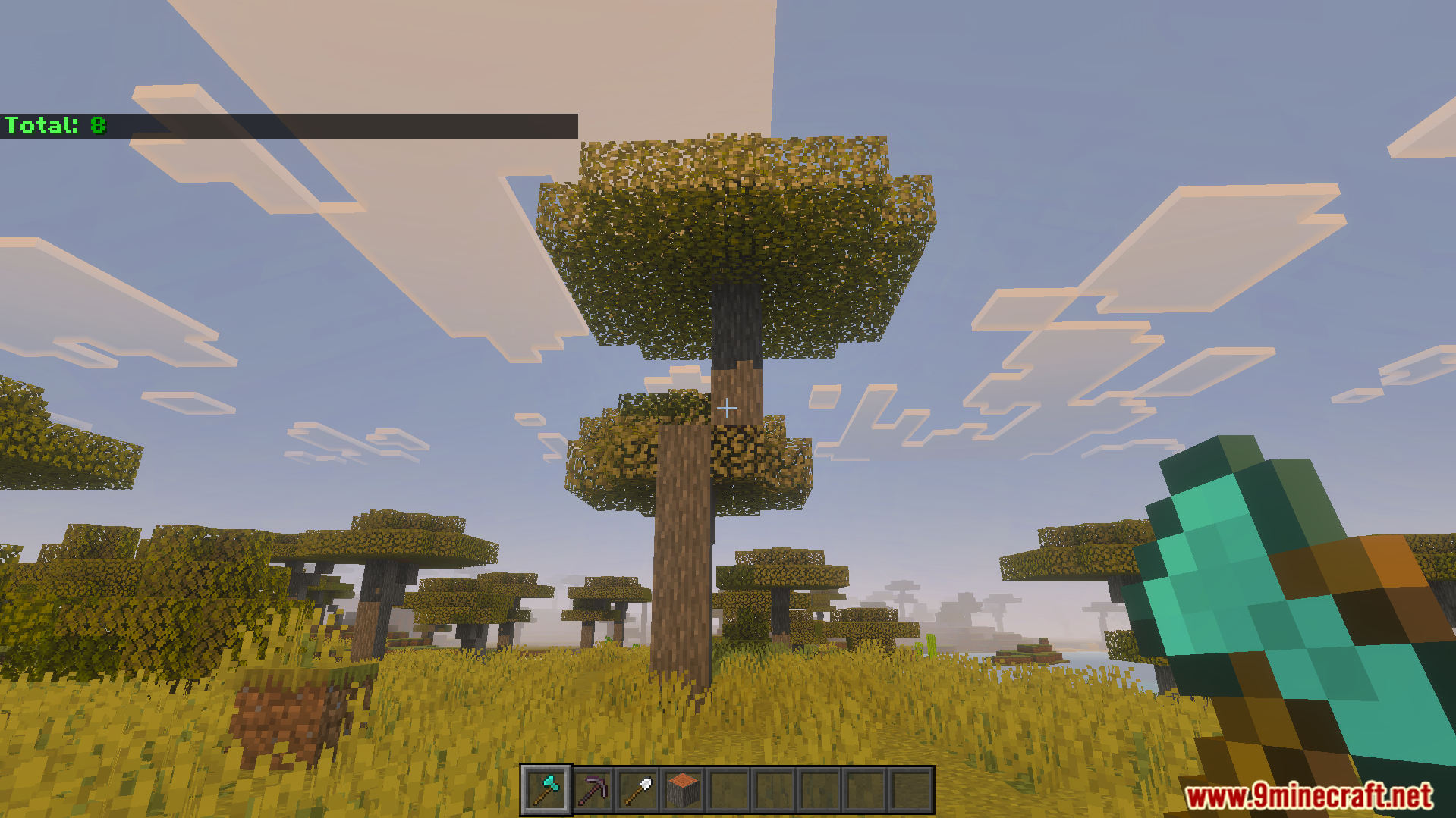 VeinMiner Tree Capitator Addon Screenshot 3 Player holding a diamond axe looking at a tall acacia tree in savanna