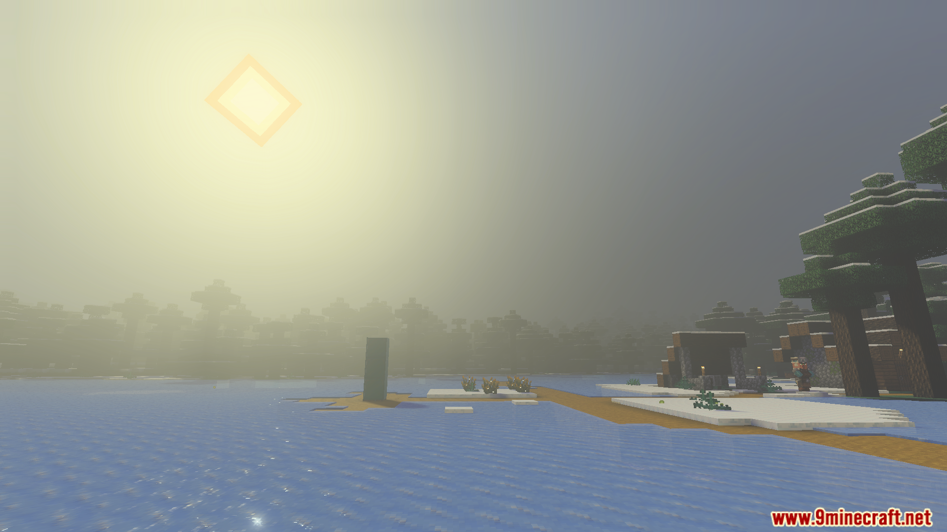 Bright sun shining over a frozen lake with trees