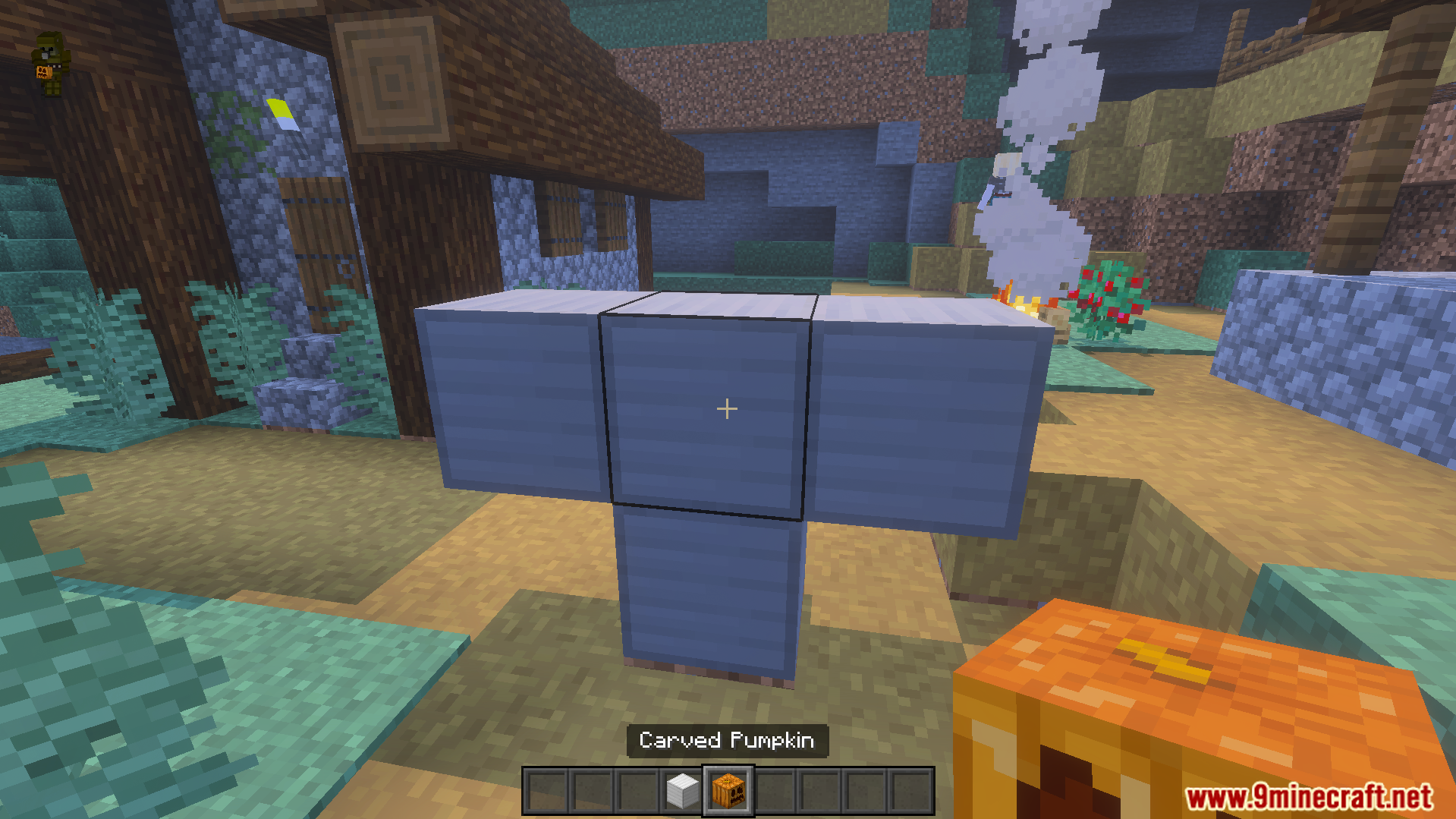 Village Girls TP Texture Pack Screenshot 7 Player holds a carved pumpkin while looking at a blue block structure