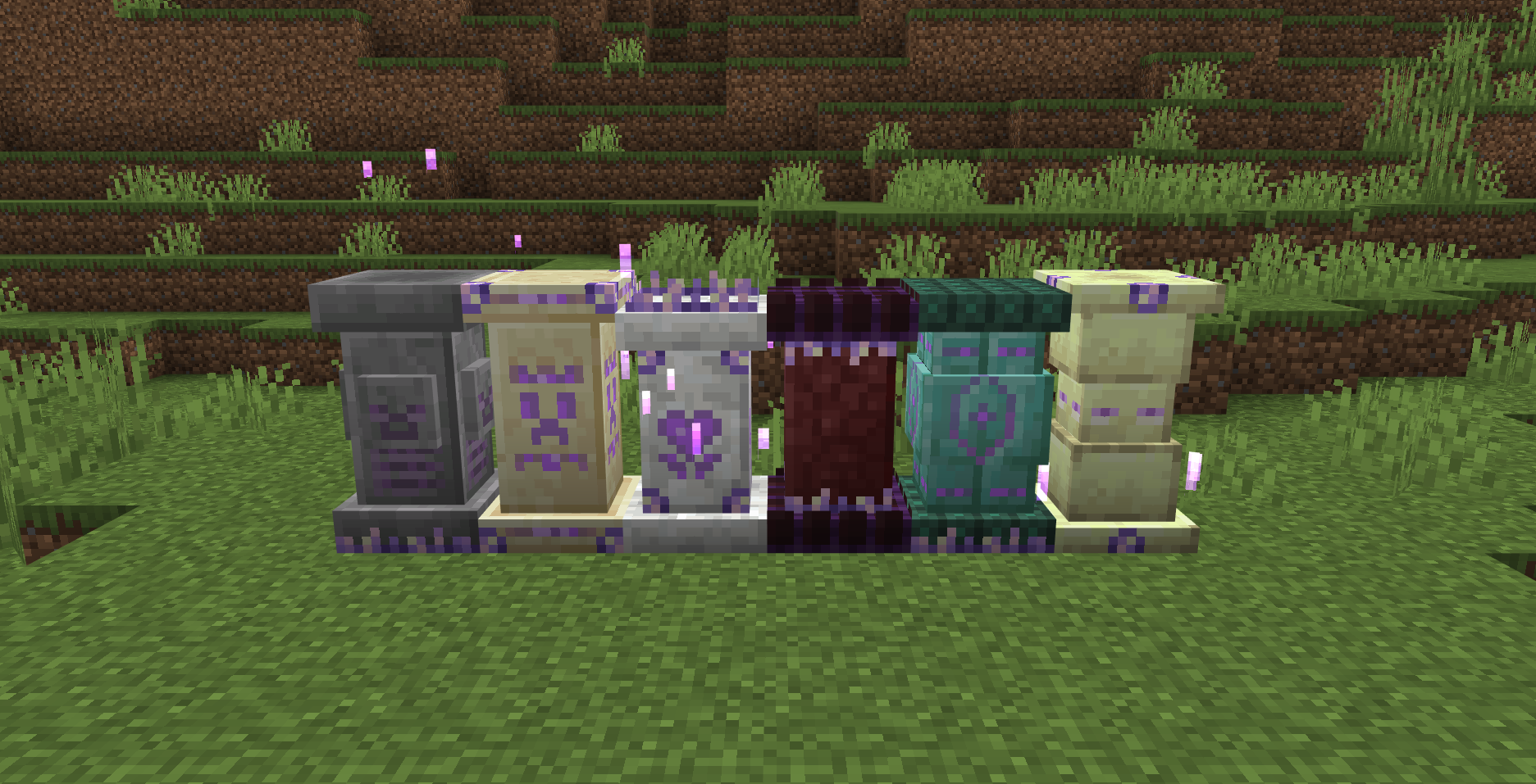 Six different types of waystone blocks placed in a row on the grass